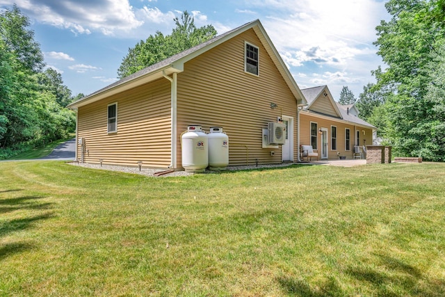 187 Hickory Dr, Auburn, ME 04210 - rear view of house with a lawn