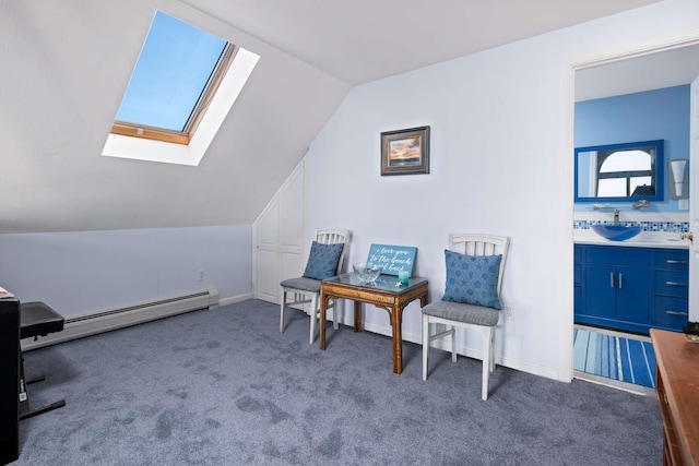 204 Nubble Rd, York, ME 03909 - living area with baseboard heating, a skylight, vaulted ceiling, and carpet