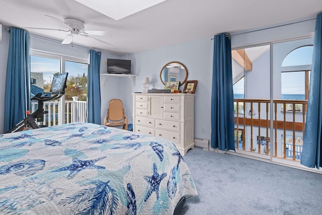 204 Nubble Rd, York, ME 03909 - carpeted bedroom with access to outside, a baseboard heating unit, and a ceiling fan
