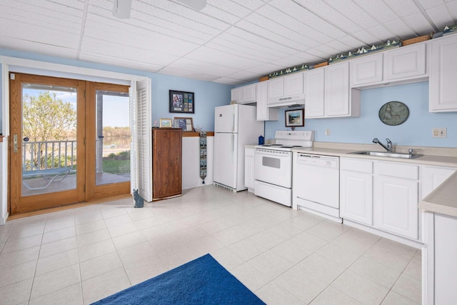 204 Nubble Rd, York, ME 03909 - kitchen featuring white appliances, under cabinet range hood, light countertops, and white cabinetry
