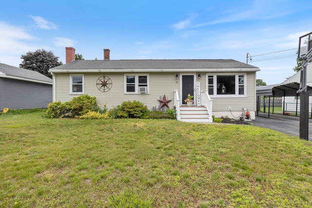 15 Lindale Ave, Biddeford, ME 04005 - view of front of property with a carport, a front lawn, and a chimney