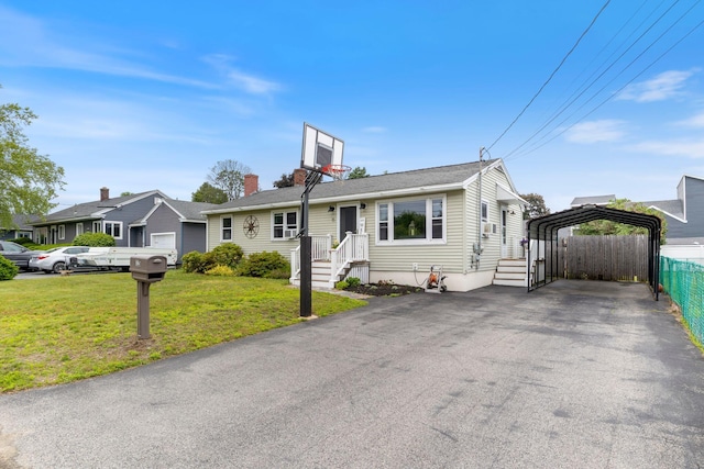 15 Lindale Ave, Biddeford, ME 04005 - view of front of home with a carport and asphalt driveway