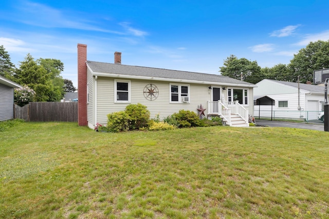 15 Lindale Ave, Biddeford, ME 04005 - view of front of house featuring a carport and a chimney