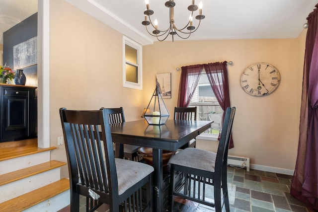 15 Lindale Ave, Biddeford, ME 04005 - dining space featuring a chandelier, stone tile floors, and a baseboard heating unit