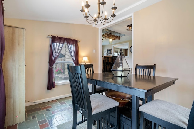 15 Lindale Ave, Biddeford, ME 04005 - dining space featuring stone tile flooring and a chandelier