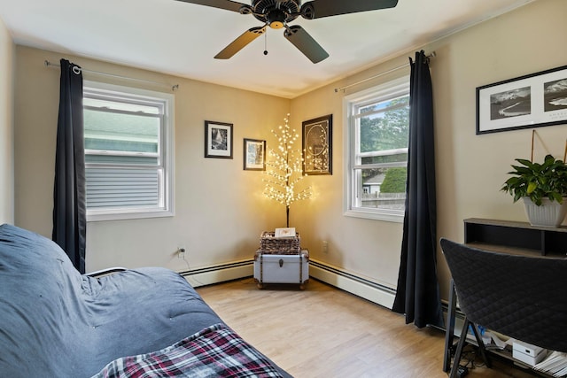 15 Lindale Ave, Biddeford, ME 04005 - sitting room featuring baseboard heating, light wood-style floors, and ceiling fan