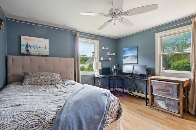 15 Lindale Ave, Biddeford, ME 04005 - bedroom featuring multiple windows, wood finished floors, and a ceiling fan