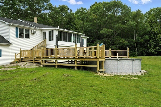 189 Old Chadbourne Rd, Lewiston, ME 04240 - back of house featuring a sunroom, a wooden deck, a chimney, and an outdoor pool