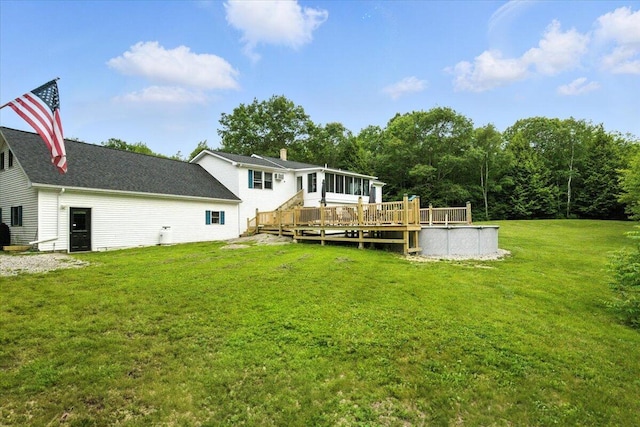 189 Old Chadbourne Rd, Lewiston, ME 04240 - rear view of property with a deck, a sunroom, a lawn, and an outdoor pool