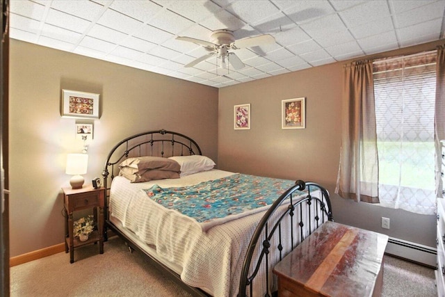 189 Old Chadbourne Rd, Lewiston, ME 04240 - bedroom featuring carpet floors, a baseboard heating unit, a ceiling fan, and a drop ceiling