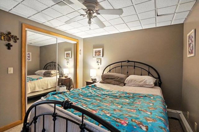 189 Old Chadbourne Rd, Lewiston, ME 04240 - carpeted bedroom with a baseboard radiator, a closet, and ceiling fan
