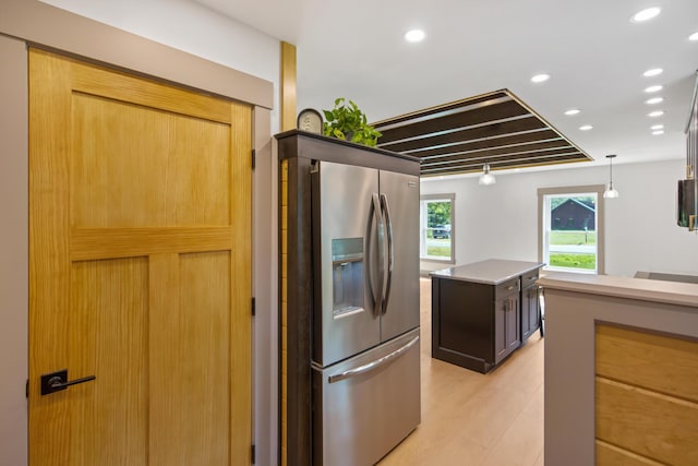 1719 Dixmont Rd, Etna, ME 04434 - kitchen with stainless steel fridge, a center island, recessed lighting, decorative light fixtures, and light countertops