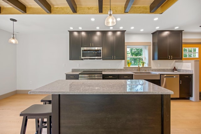 1719 Dixmont Rd, Etna, ME 04434 - kitchen featuring appliances with stainless steel finishes, beam ceiling, light wood-type flooring, recessed lighting, and plenty of natural light