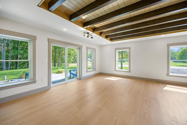 1719 Dixmont Rd, Etna, ME 04434 - spare room with light wood-style flooring, plenty of natural light, and a wood ceiling with exposed beams