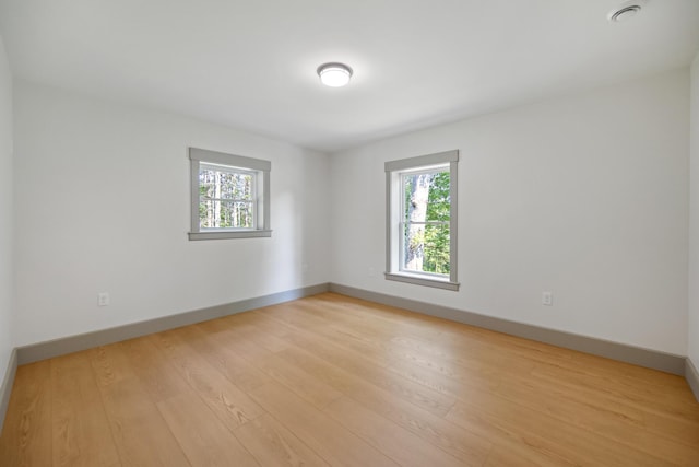 1719 Dixmont Rd, Etna, ME 04434 - empty room featuring healthy amount of natural light and light wood-style floors