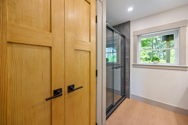 1719 Dixmont Rd, Etna, ME 04434 - bathroom featuring a shower stall, recessed lighting, and wood finished floors