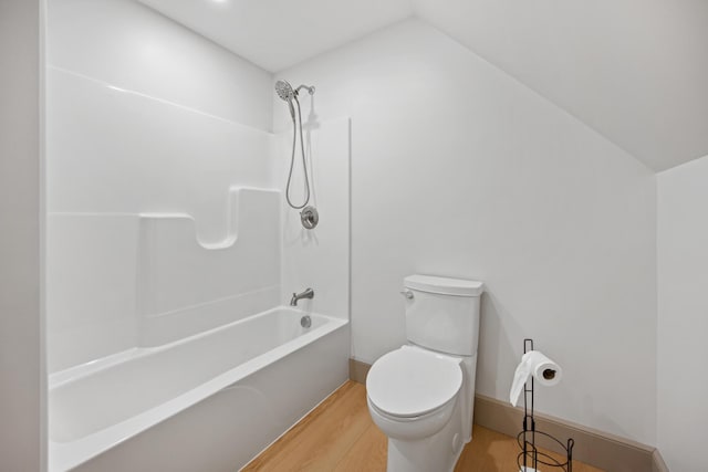 1719 Dixmont Rd, Etna, ME 04434 - bathroom with shower / washtub combination, wood finished floors, and vaulted ceiling