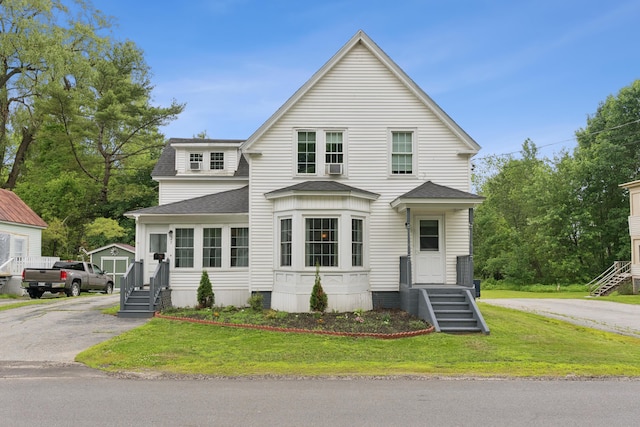 25 Searles St, Livermore Falls, ME 04254 - view of front of home with a shingled roof and a front yard