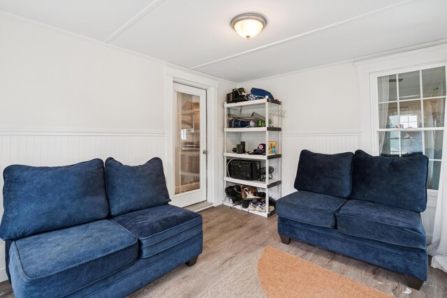25 Searles St, Livermore Falls, ME 04254 - living area featuring wood finished floors and wainscoting