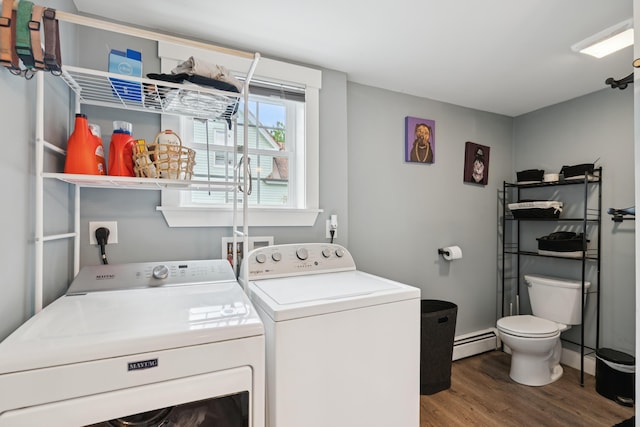 25 Searles St, Livermore Falls, ME 04254 - washroom featuring baseboard heating, washer and clothes dryer, and wood finished floors