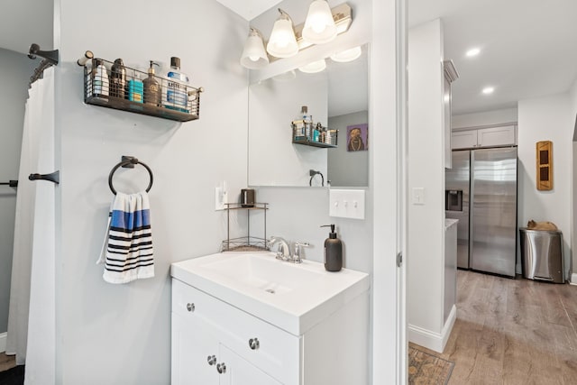 25 Searles St, Livermore Falls, ME 04254 - full bath with vanity, wood finished floors, and recessed lighting