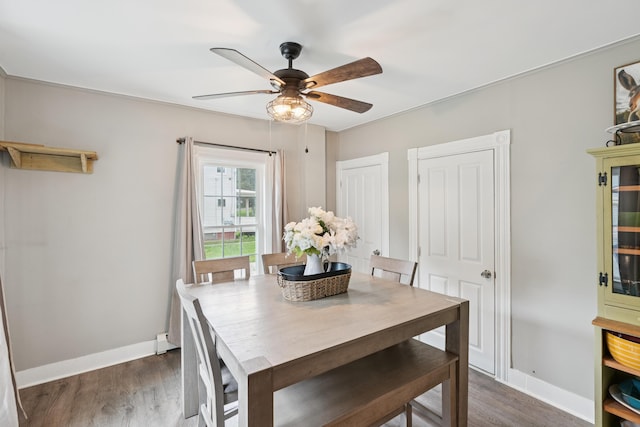 25 Searles St, Livermore Falls, ME 04254 - dining area with ceiling fan and dark wood-style floors