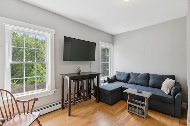 25 Searles St, Livermore Falls, ME 04254 - living area featuring plenty of natural light and wood finished floors