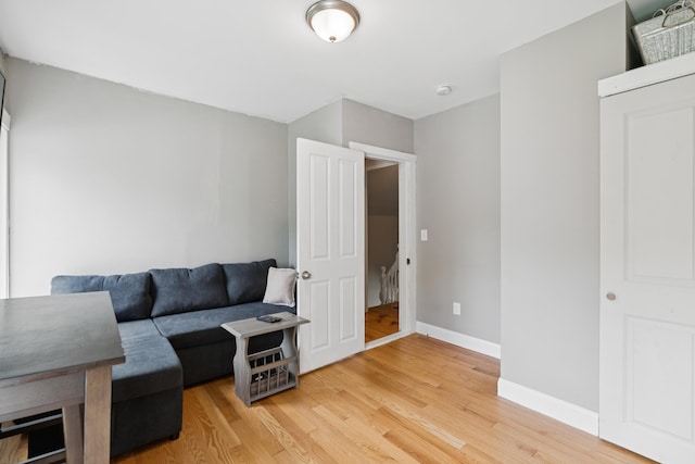 25 Searles St, Livermore Falls, ME 04254 - living area featuring light wood-style flooring and baseboards