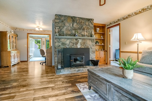 14 Old County Rd, South Berwick, ME 03908 - living area with wood finished floors, a wood stove, and built in features