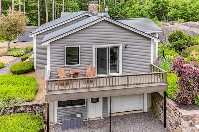 14 Old County Rd, South Berwick, ME 03908 - rear view of property featuring an attached garage, a deck, and a chimney
