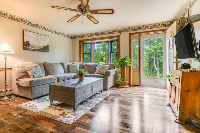 14 Old County Rd, South Berwick, ME 03908 - living room featuring a ceiling fan, wood finished floors, and a baseboard radiator