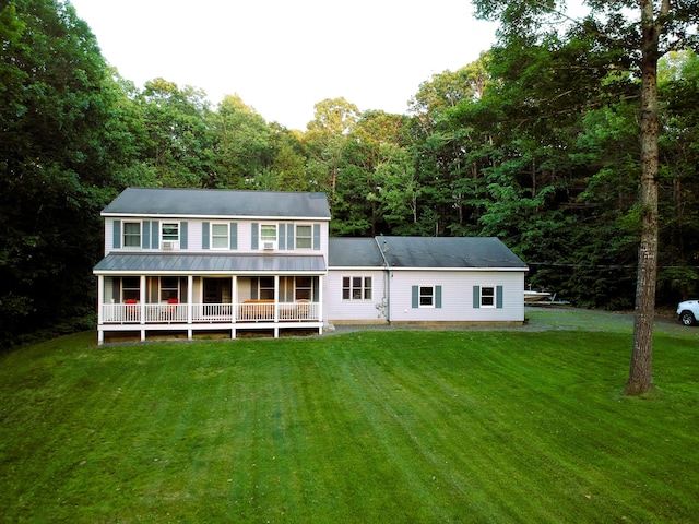 66 Stoney Acres Rd, Pittston, ME 04345 - rear view of property featuring covered porch, a lawn, a metal roof, and a view of trees
