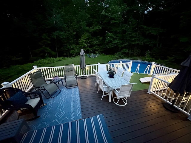 66 Stoney Acres Rd, Pittston, ME 04345 - wooden terrace with outdoor dining area and a lawn