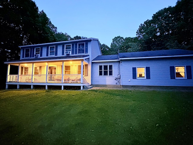 66 Stoney Acres Rd, Pittston, ME 04345 - rear view of house with a lawn and covered porch