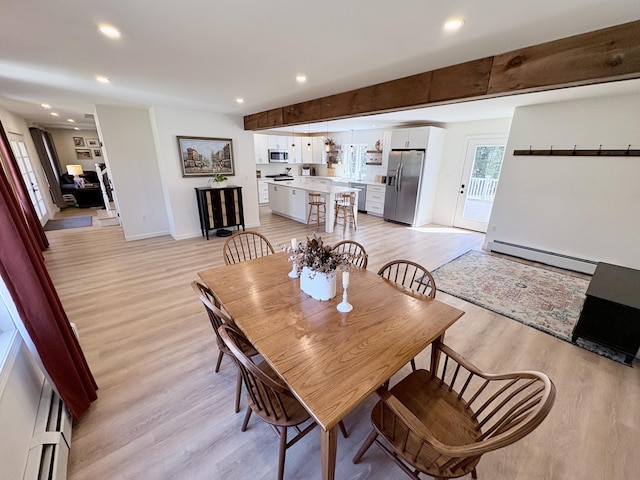 66 Stoney Acres Rd, Pittston, ME 04345 - dining room with a baseboard heating unit, light wood-style floors, and recessed lighting