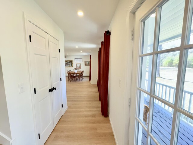 66 Stoney Acres Rd, Pittston, ME 04345 - hall with light wood finished floors, plenty of natural light, and recessed lighting