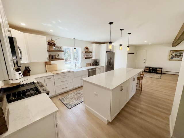 66 Stoney Acres Rd, Pittston, ME 04345 - kitchen featuring open shelves, appliances with stainless steel finishes, light wood finished floors, a center island, and recessed lighting