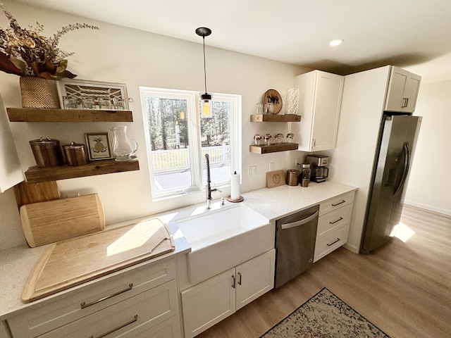 66 Stoney Acres Rd, Pittston, ME 04345 - kitchen featuring open shelves, appliances with stainless steel finishes, wood finished floors, white cabinets, and recessed lighting