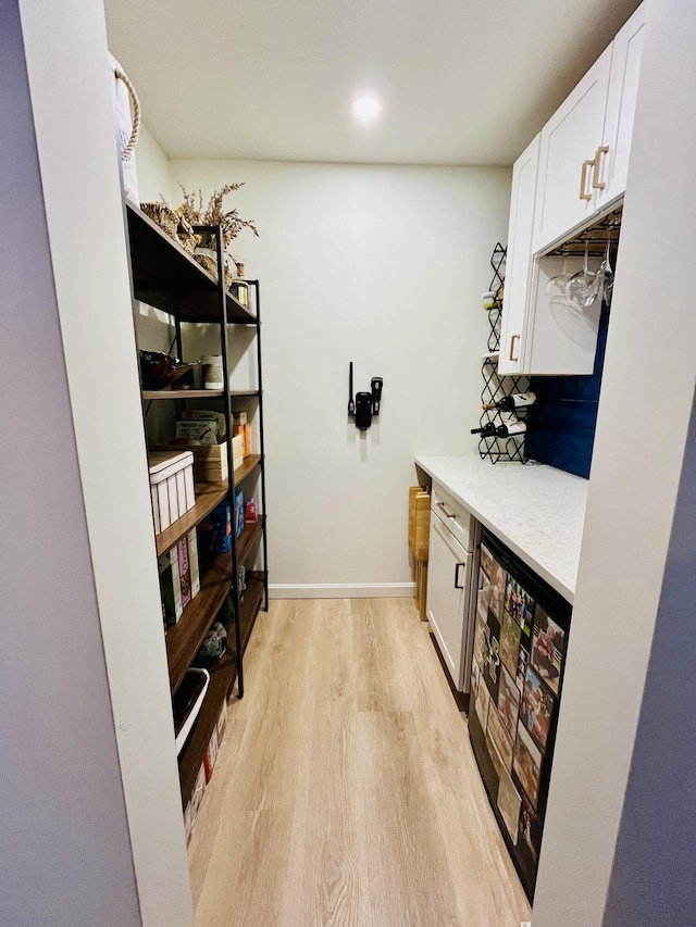 66 Stoney Acres Rd, Pittston, ME 04345 - laundry area with light wood-style flooring, a bar, and recessed lighting