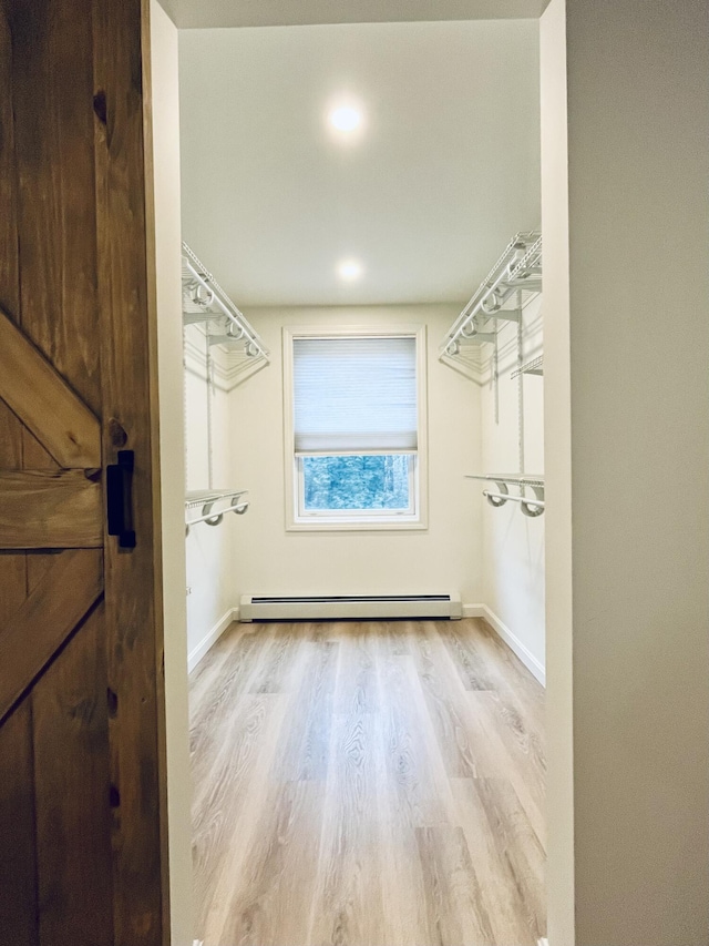 66 Stoney Acres Rd, Pittston, ME 04345 - spacious closet with a baseboard radiator and wood finished floors
