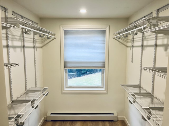 66 Stoney Acres Rd, Pittston, ME 04345 - walk in closet with a baseboard radiator and wood finished floors