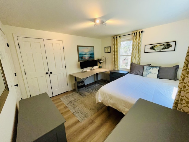 66 Stoney Acres Rd, Pittston, ME 04345 - bedroom with wood finished floors, an office area, and a closet