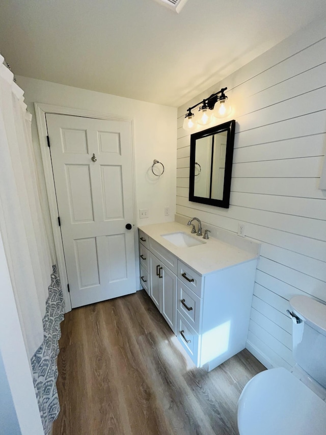 66 Stoney Acres Rd, Pittston, ME 04345 - full bathroom with wooden walls, vanity, and wood finished floors