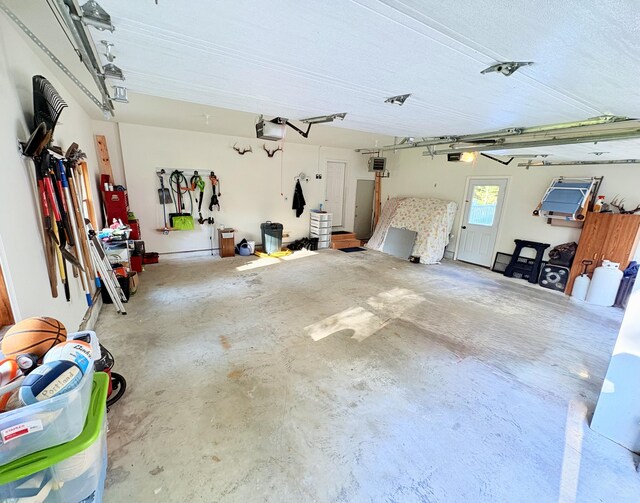 66 Stoney Acres Rd, Pittston, ME 04345 - garage featuring a garage door opener