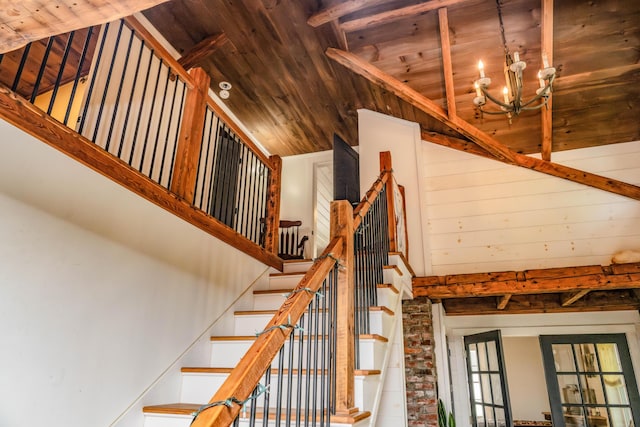 17 Green St, Dover-Foxcroft, ME 04426 - stairway featuring a wood ceiling with exposed beams, a chandelier, and high vaulted ceiling