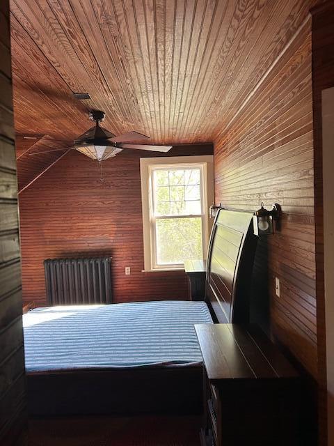 28 Holly St, Auburn, ME 04210 - bedroom with wood ceiling, wooden walls, and a ceiling fan