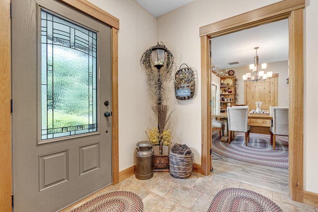 16 Keystone Spring Rd, Poland, ME 04274 - entrance foyer with healthy amount of natural light and a chandelier