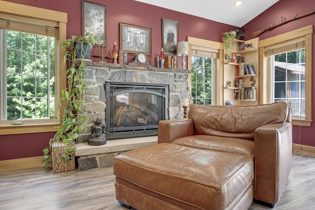 16 Keystone Spring Rd, Poland, ME 04274 - living room featuring wood finished floors, vaulted ceiling, a fireplace, and recessed lighting