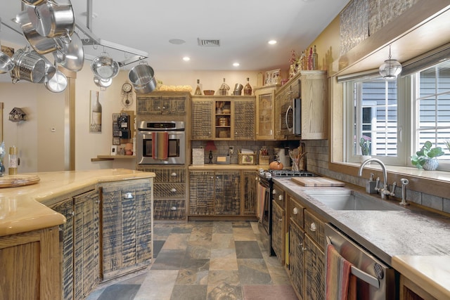 16 Keystone Spring Rd, Poland, ME 04274 - kitchen featuring appliances with stainless steel finishes, stone finish floors, decorative backsplash, recessed lighting, and light countertops