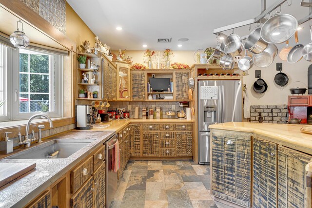 16 Keystone Spring Rd, Poland, ME 04274 - kitchen featuring stainless steel appliances, open shelves, tasteful backsplash, stone finish flooring, and light countertops
